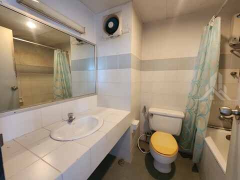 Bathroom sink and toilet before renovation at Chain Condominium, Jomtien, Floor 8 Unit 13, Pattaya