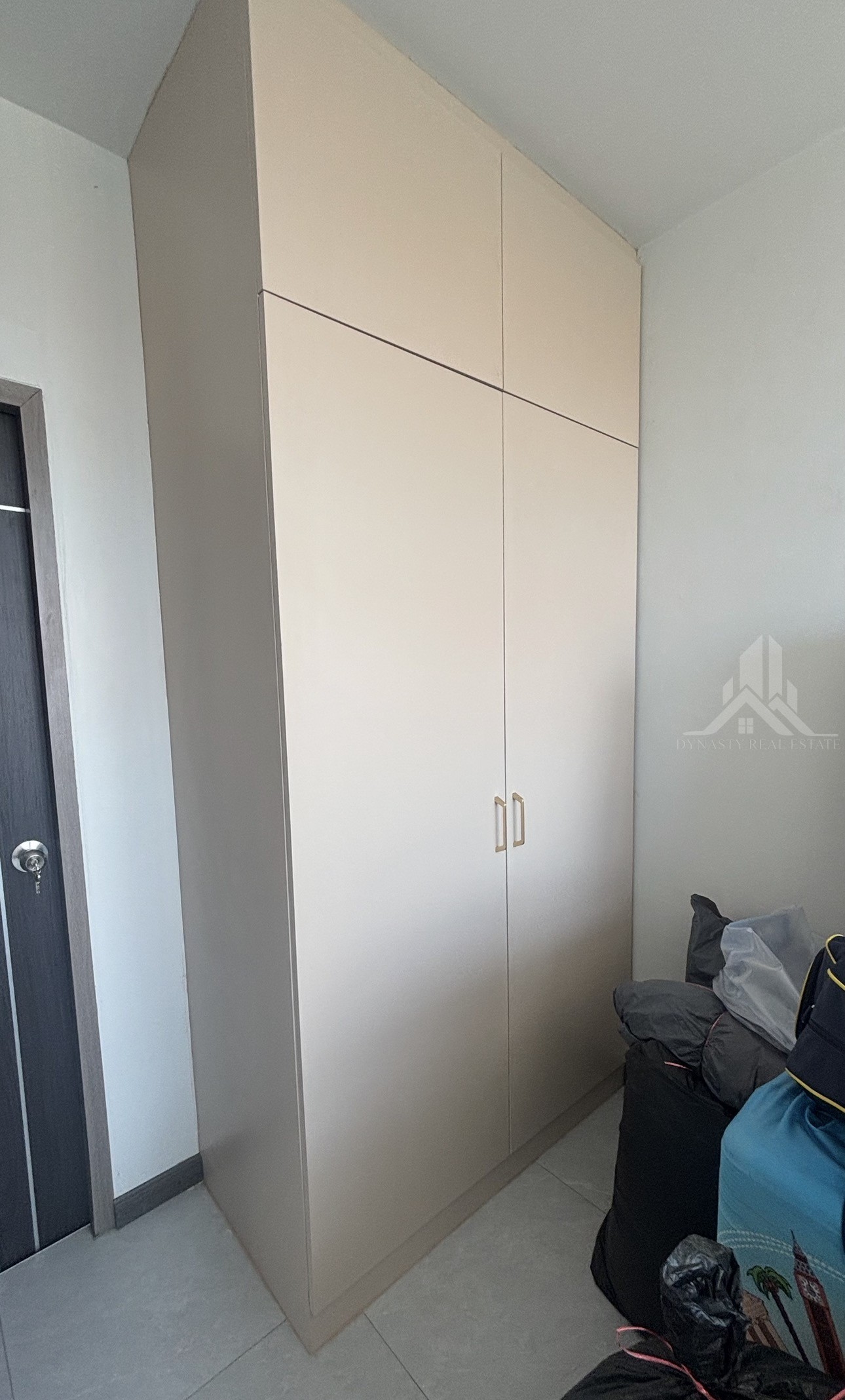 Completed: Built-In Furniture Renovation At Treetops Pattaya Condo For Sale In Pattaya Floor-to-ceiling built-in two-door wardrobe with top cabinets in a treetops pattaya condo bedroom